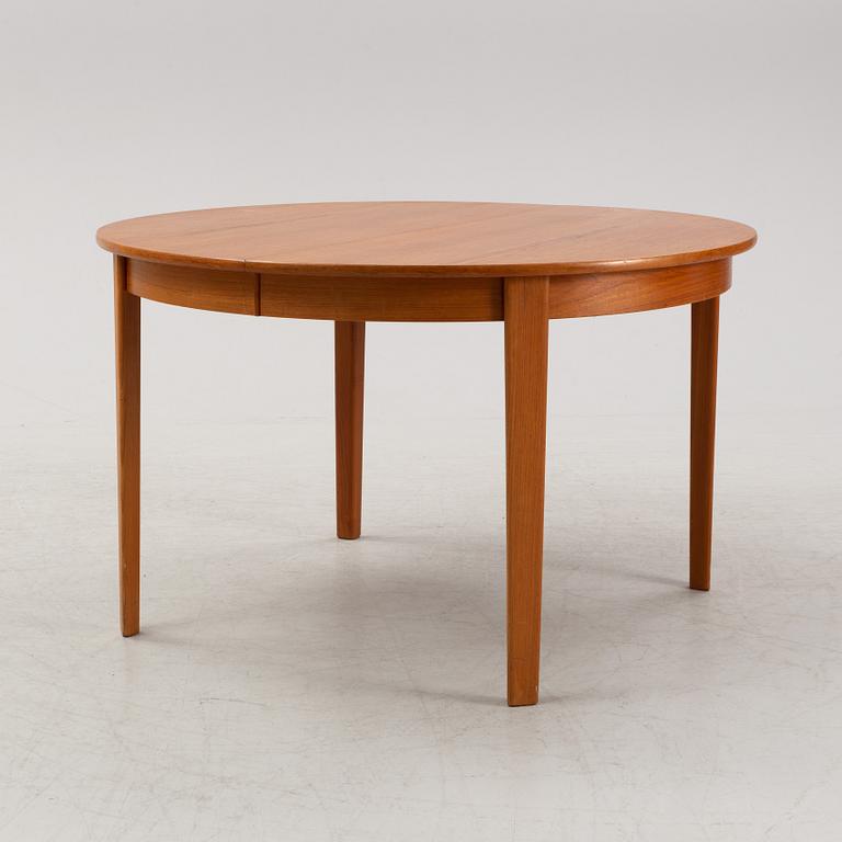 A 1950's/60's teak-veneered dining table.