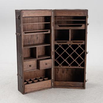 A leather suitcase-shaped bar cabinet.