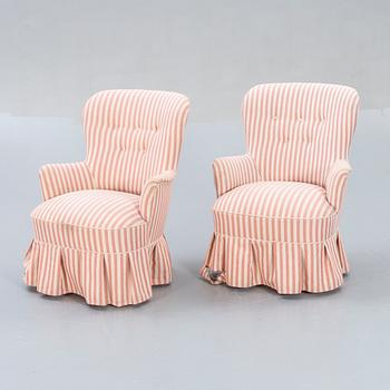 A pair of Modern easy chairs.