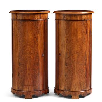 137. A pair of late Empire mahogany column cabinets, mid 19th Century.