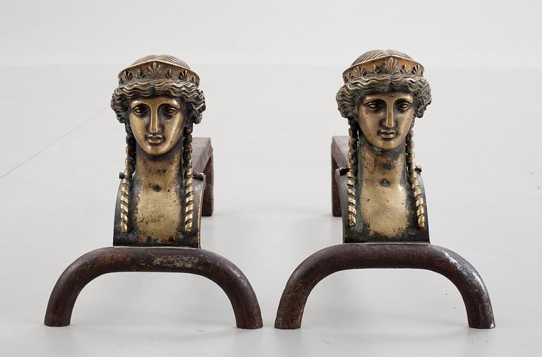 A pair of French Empire early 19th century fire dogs.