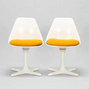 Set of 8 vintage swivel chairs model 115 and a table by Maurice Burke for Arkana, United Kingdom, 1960s.