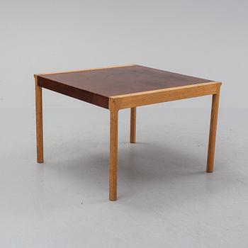 An oak and leather coffee table, mid 20th Century.