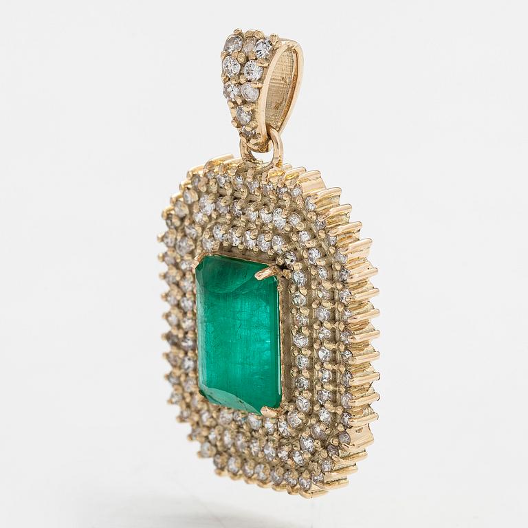 A 14K gold pendant with emerald and brilliant cut diamonds totaling approx. 0.95 ct.