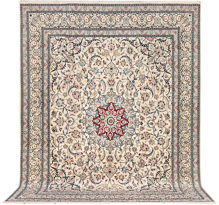 A Nain carpet, part silk, 9 laa, c. 390 x 295 cm.