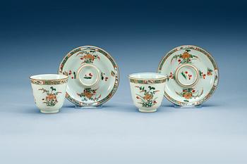 A pair of famille verte  cups with stands,  Qing dynasty, Kangxi (1662-1722).