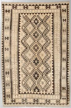 A kelim rug, 248 x 163 cm.