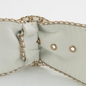 Chanel, a white leather belt.