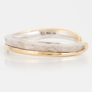 A Georg Jensen silver bangle.