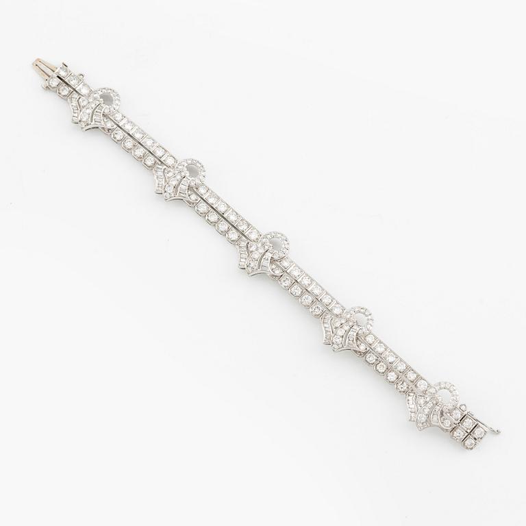 A platinum bracelet with round brilliant-, eight- and baguette-cut diamonds, Gübelin, founded in 1854.