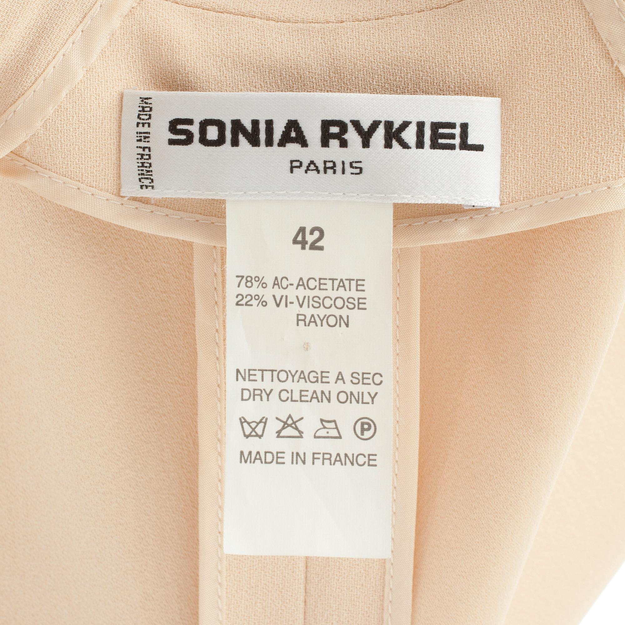 SONIA RYKIEL, a two-piece creme colored dress consisting of jacket and skirt.