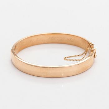 A 14K gold bracelet.