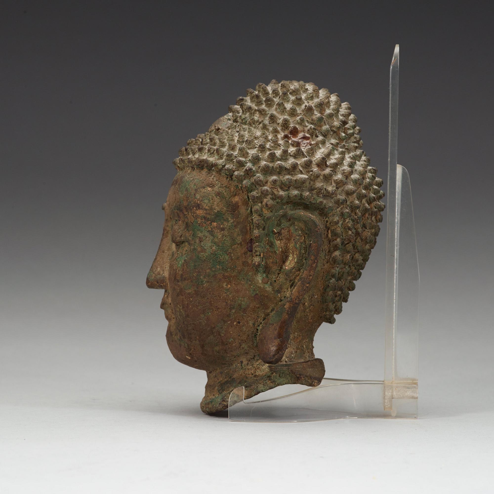 A bronze head of buddha, Ming dynasty (1368-1644).