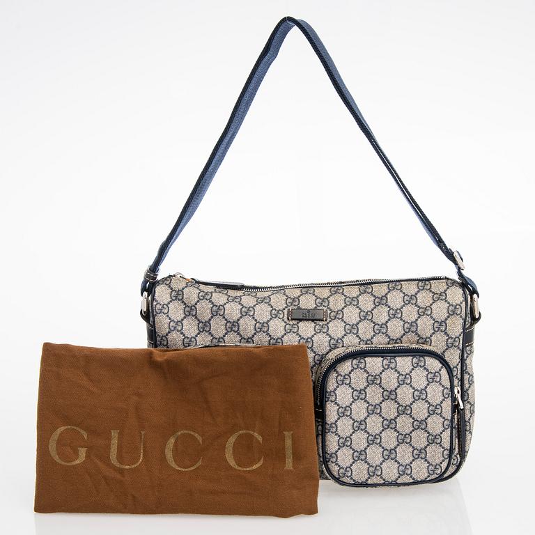 Gucci, A "GG Supreme messenger" bag.