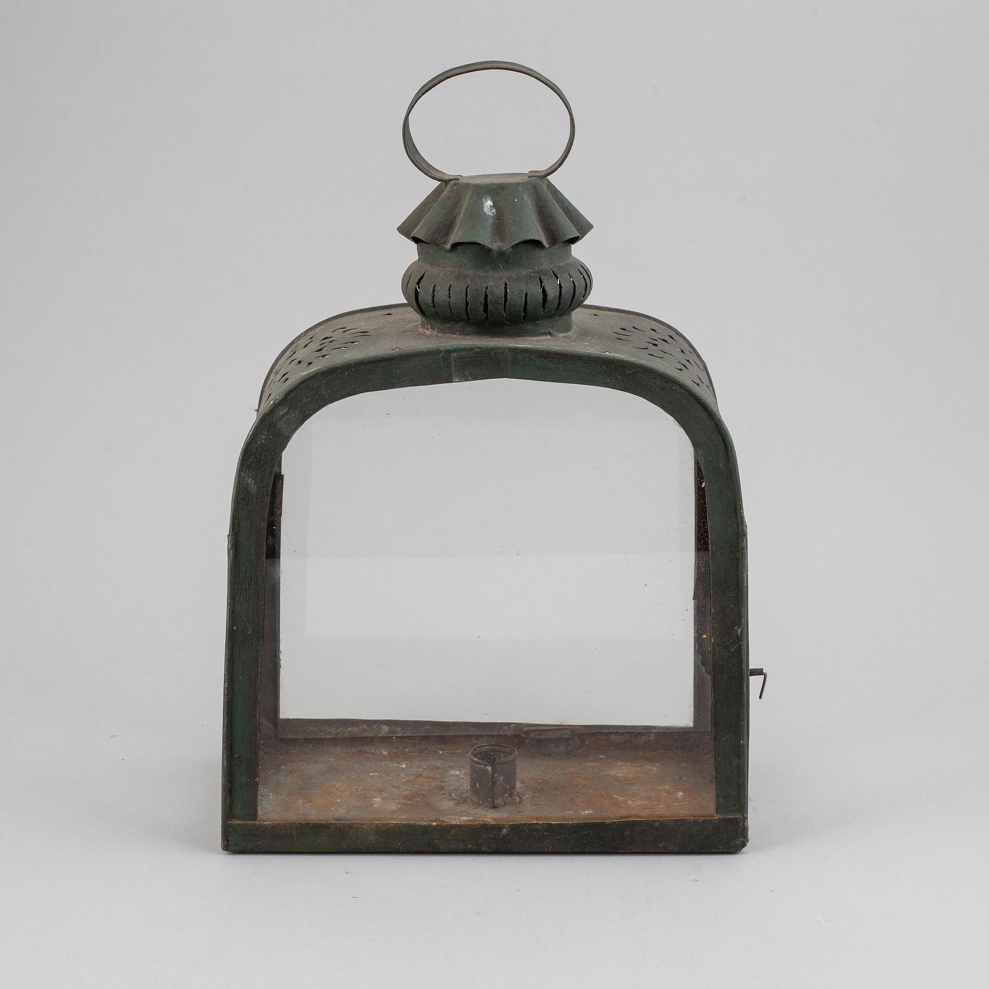 An 18th century tinplate and glass lantern.