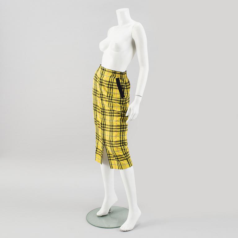 A checkered skirtby Jean Paul Gaultier.