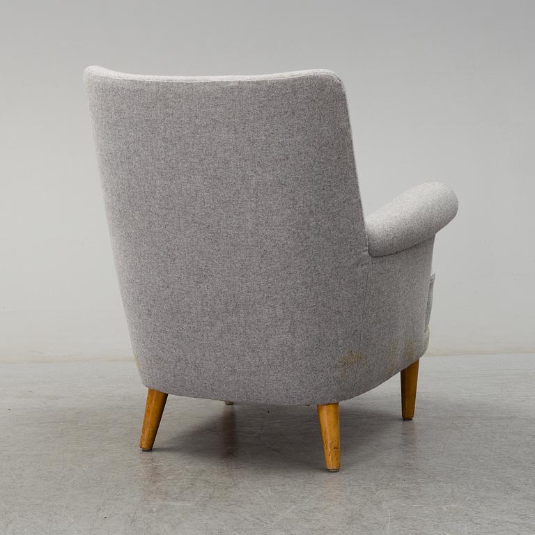 A 'Hemmakväll' easy chair by Carl Malmsten, late 20th century.