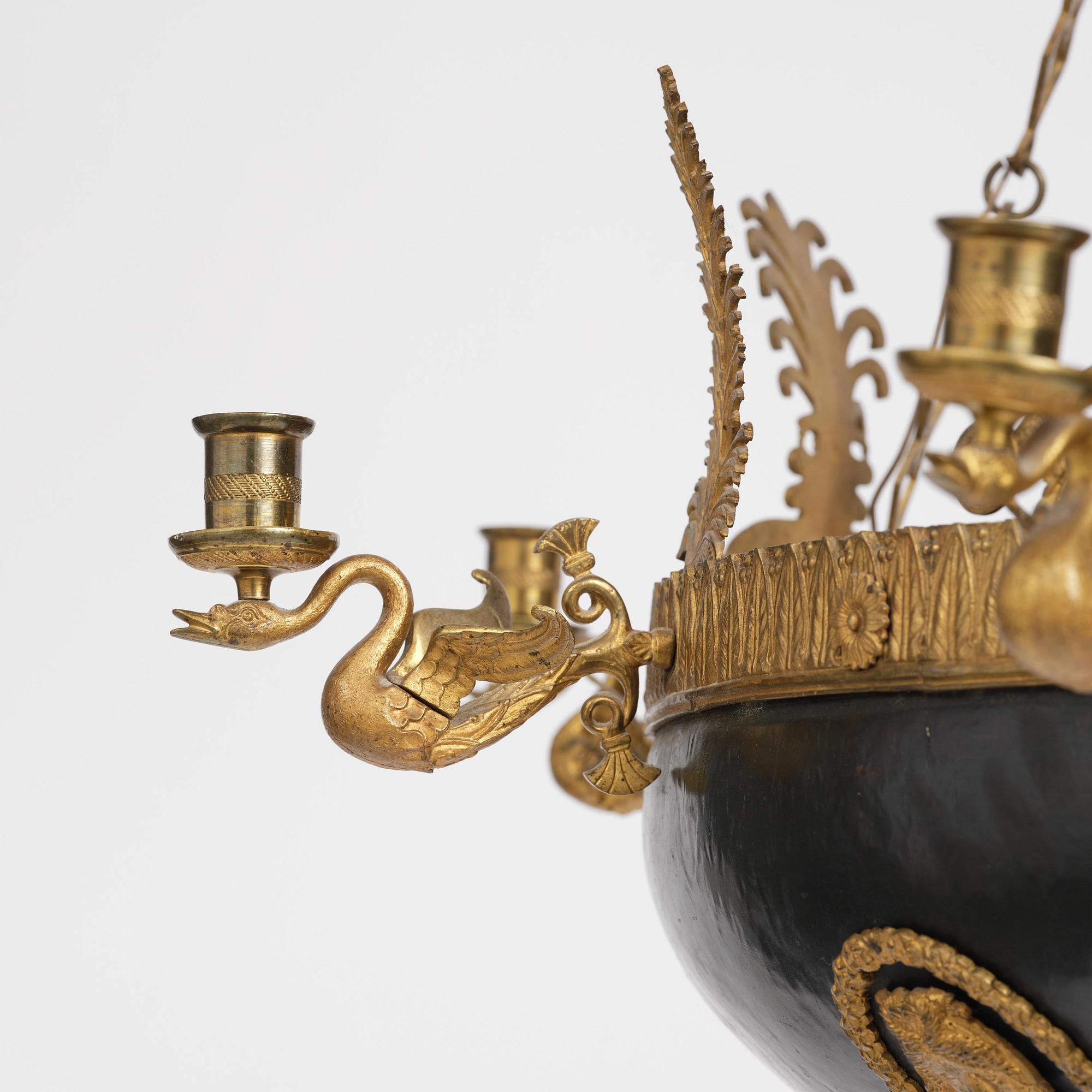 A presumably Russian Empire gilt and patinated bronze nine-branch chandelier, 19th century.