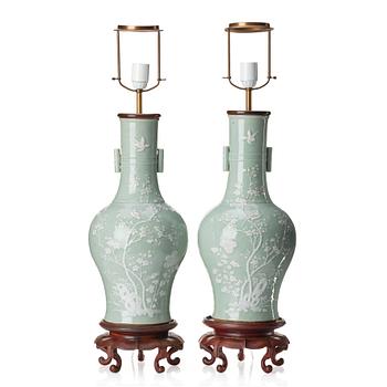 1014. A pair of large celadon glazed slip decorated vases, Qing dynasty, 19th Century.