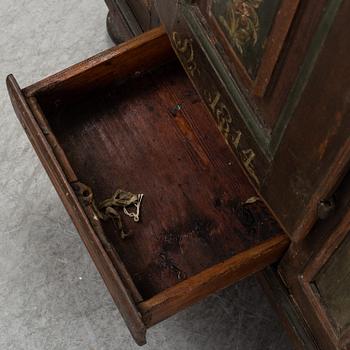 A painted cabinet, marked 1814.