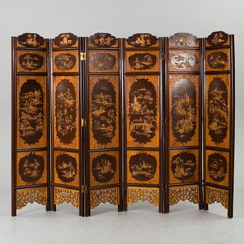 A chinese 20th century six-panel relief wood screen.