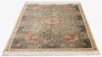 A silk Qum, Central Persia. signed Mohammad Gamshidi, c. 203 x 126 cm.