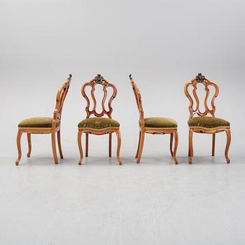 A rococo style sofa, four chairs and a table, second half of the 19th Century.