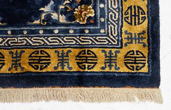 A semi-antique silk Chinaese 'Antique finish' rug, c. 175 x 122 cm.