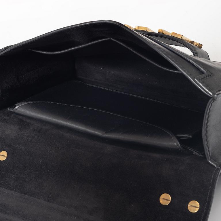 Christian Dior, A black leather "Dio(r)evolution" bag.