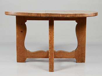 A stained pine dining table, attributed to Axel Einar Hjorth, Nordiska Kompaniet, 1930's.