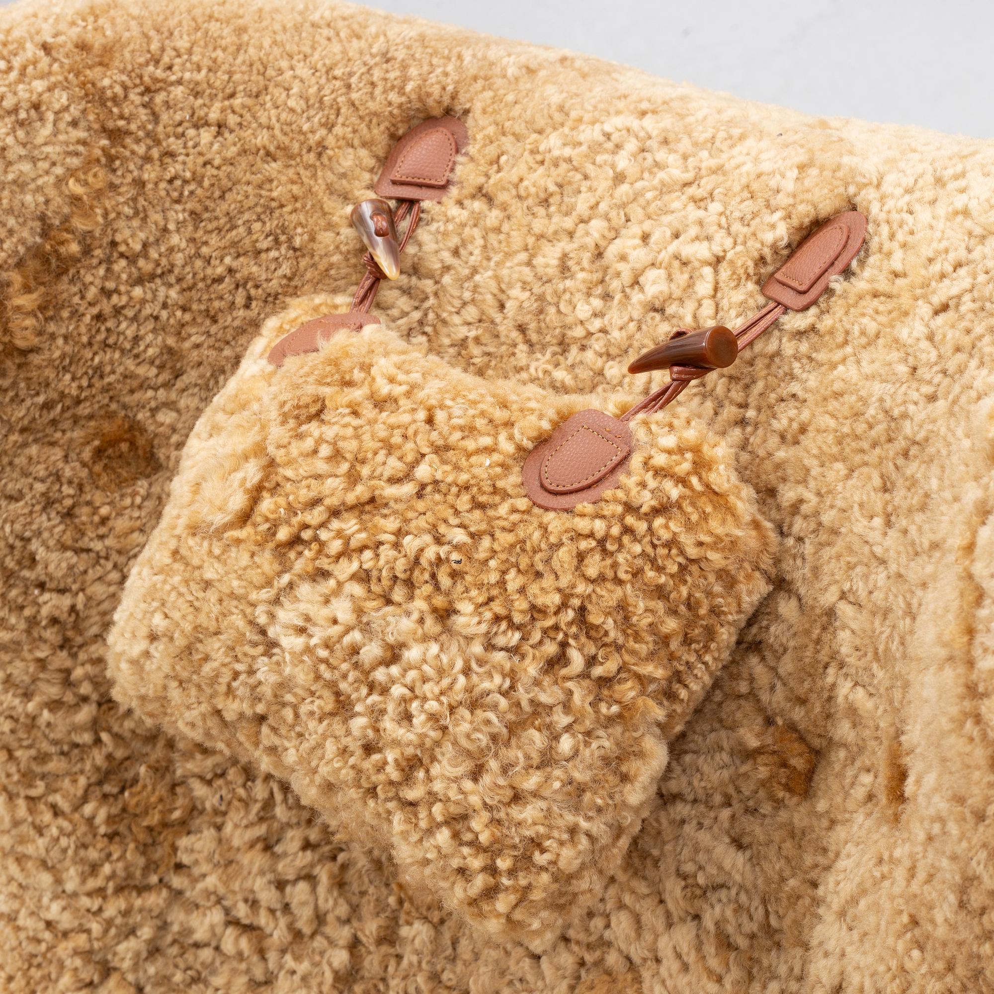 Fåtölj med fotpall, 1900-talets första hälft.