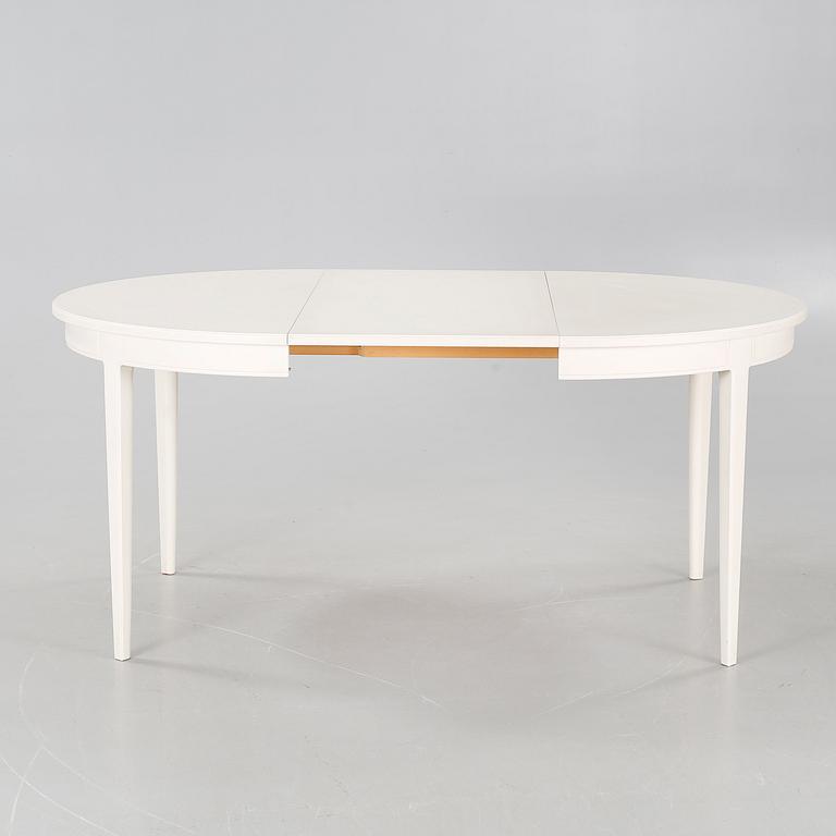 A dining table named "Herrgården", designed by Carl Malmsten.