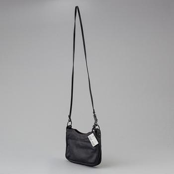 A black alligator printed leather "Classic hip" bag by Balenciaga.