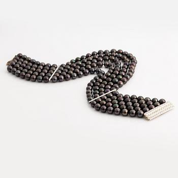Bracelet and necklace, cultured black pearls, gold and white gold with brilliant-cut diamonds.