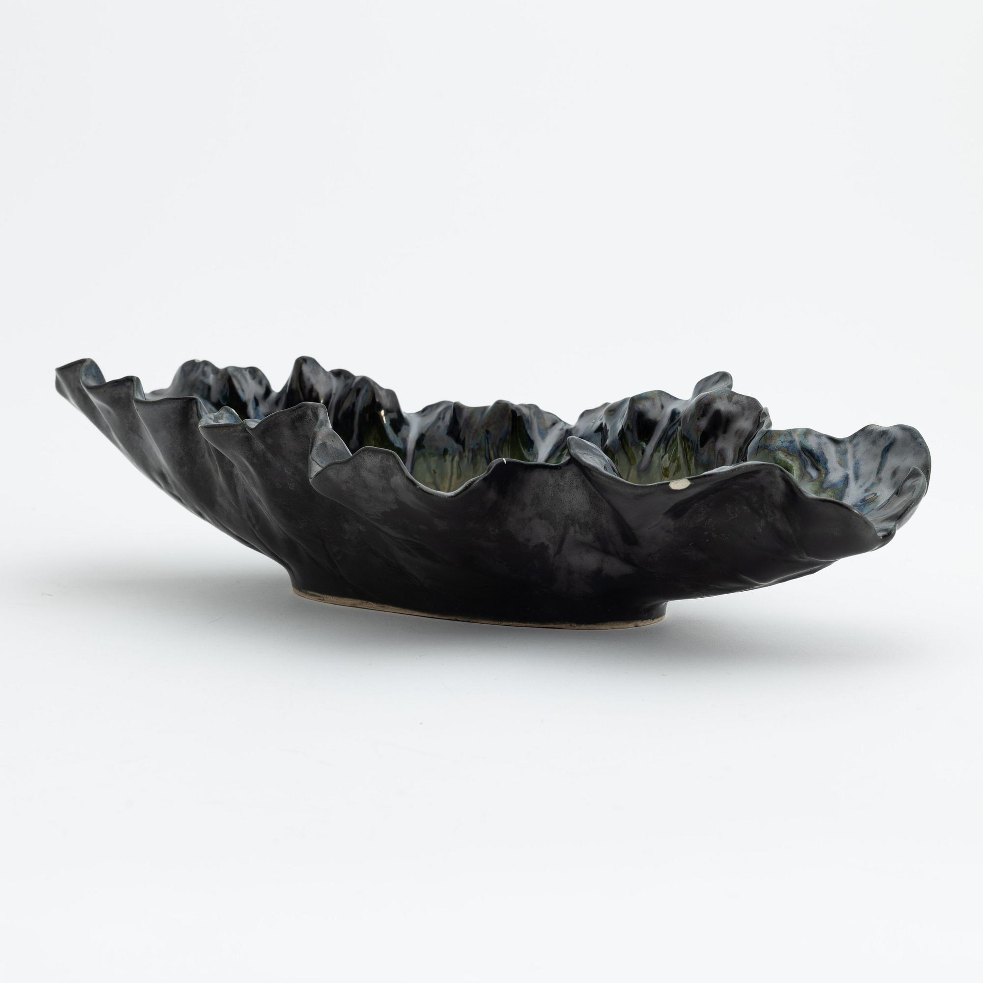 Pol Chambost, a glazed ceramic leaf shaped bowl or dish, signed.