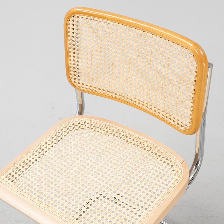 A set of five steel and rattan chairs from the late 20th century.