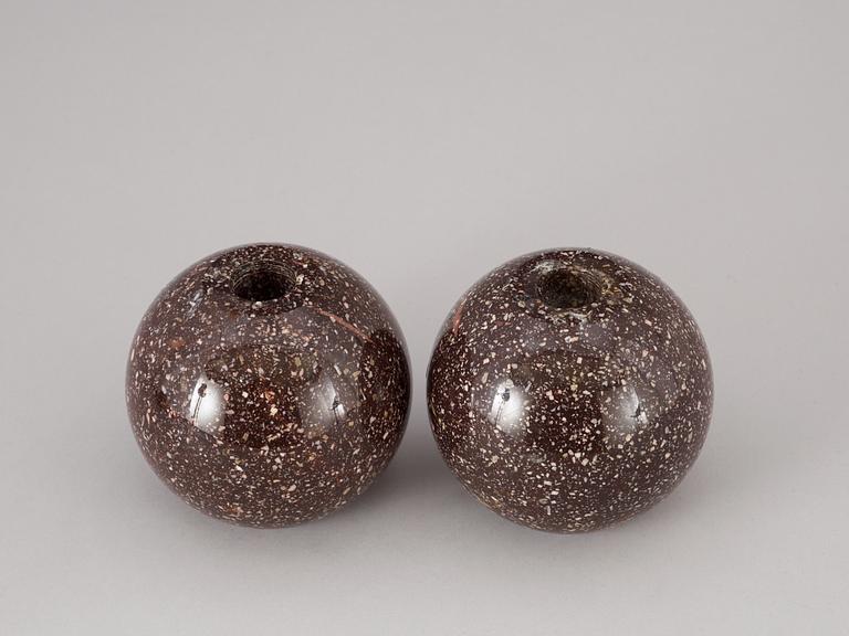 A pair of circa 1900 porphyry candlesticks.