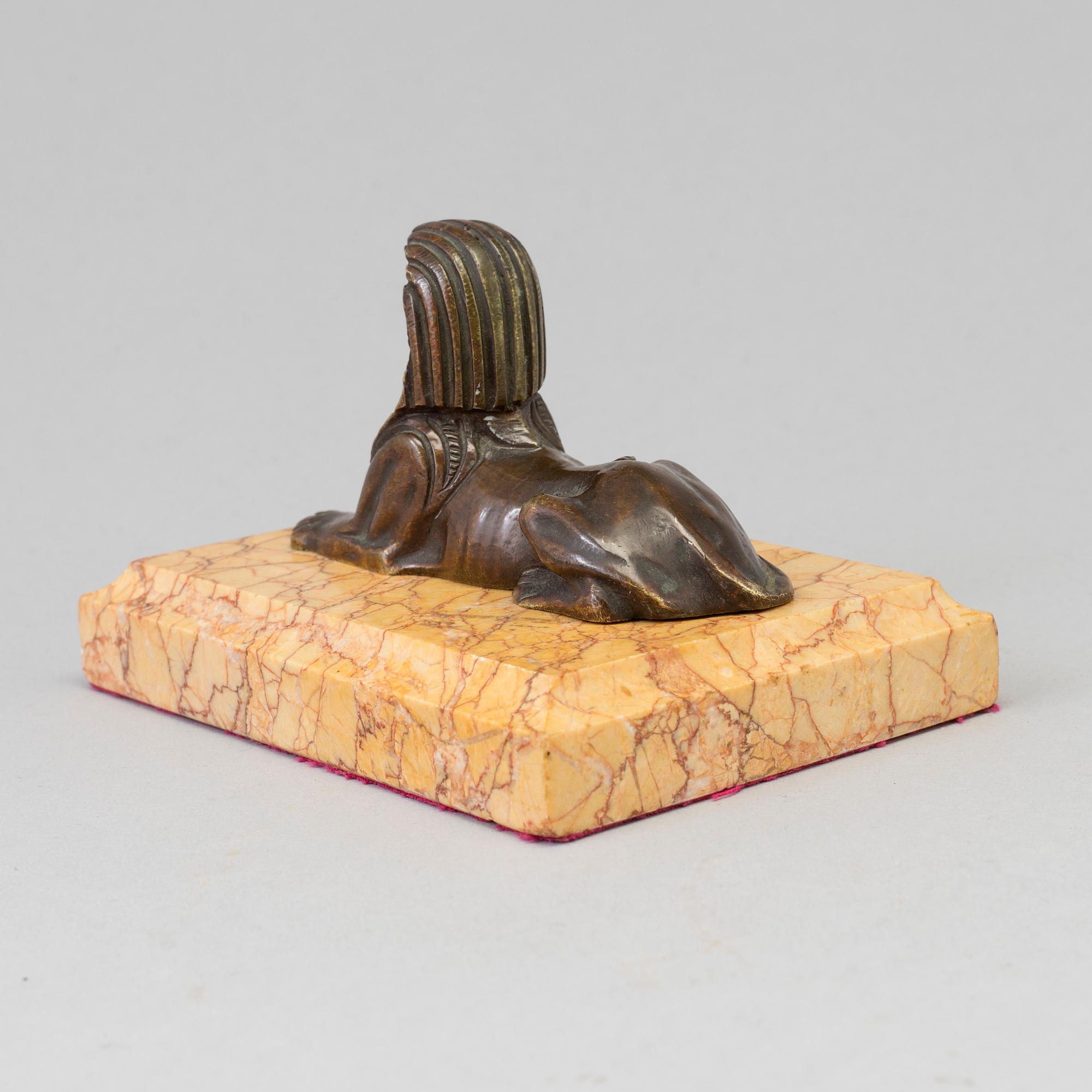 AN EMPIRE  BRONZE AND MARBLE PAPER WEIGHT, early 19th century.