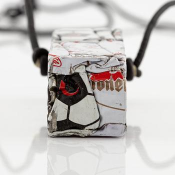 César Baldaccini, compression, pendant made of compressed beer bottle caps.