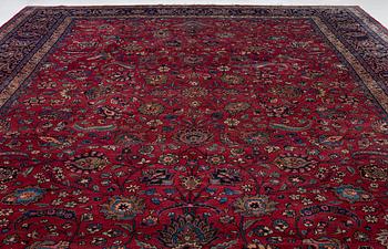 A semi-antique Mashad carpet of Shah Abbas design, c 516 x 360 cm.