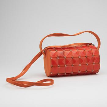 GIANNI VERSACE, a pair of orange lady's shoes and a handbag.