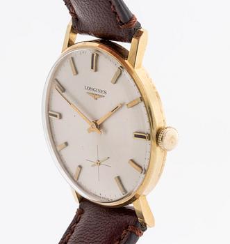 A Longines 18 ct gold wrist watch, ca 32 mm.