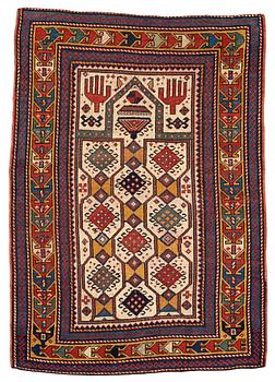 190. A RUG, an antique Caucasian prayer rug, Czar Russia, ca 144-151 x 103-106 cm.