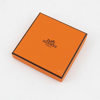 Hermès, a 'Clic H' bracelet.