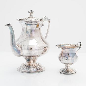 A 1950s footed bowl and a three-piece silver coffee set from the latter half of the 20th century.