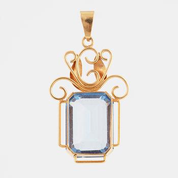 Blue synthetic spinel and 18K gold pendant.