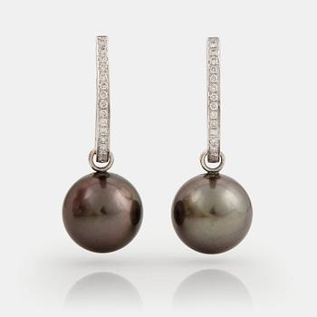 892. A pair of cultured Tahiti pearl and brilliant cut diamond earrings.