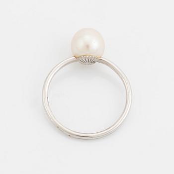 White gold earrings and ring with pearl and white stones.