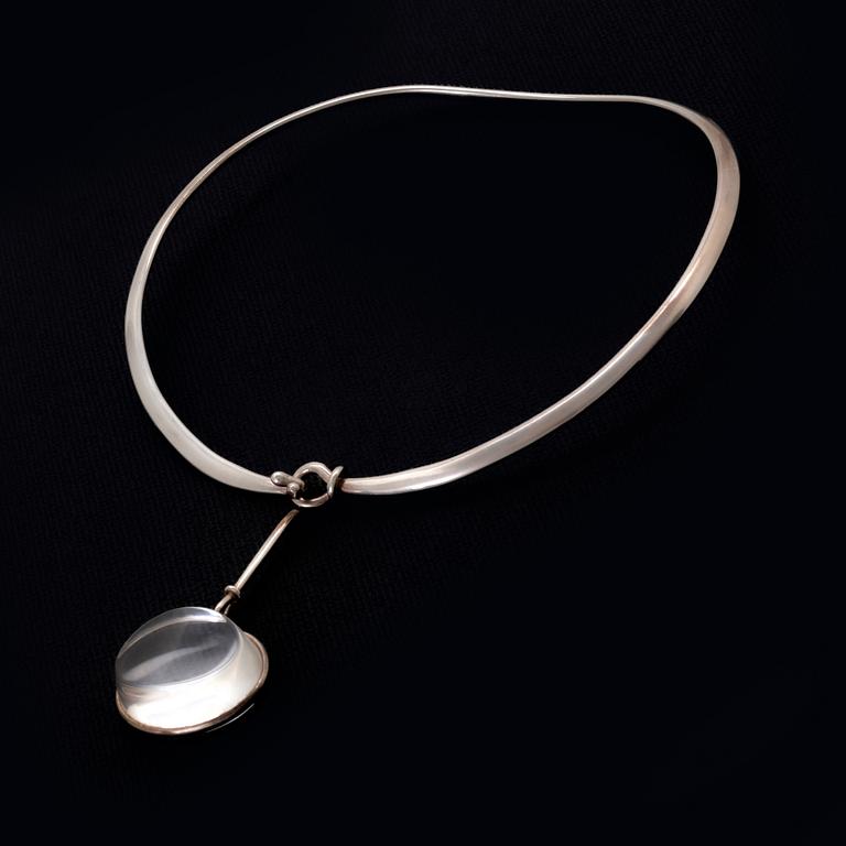 Vivianna Torun Bülow-Hübe. Necklace with pendant, sterling silver and rock crystal or glass.