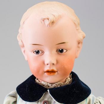 A bisque headed boy doll 7622 by Heubach, Germany, ca 1912.